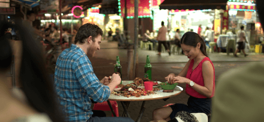 Josh and Ruby conversing over crab meat in HK.